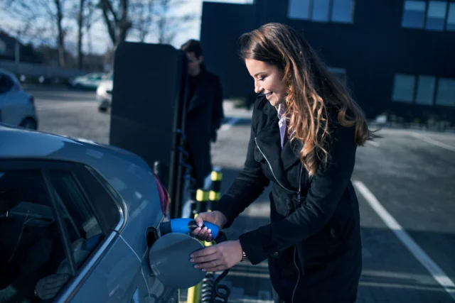 Woman Charging EV - eEnergy colour styled